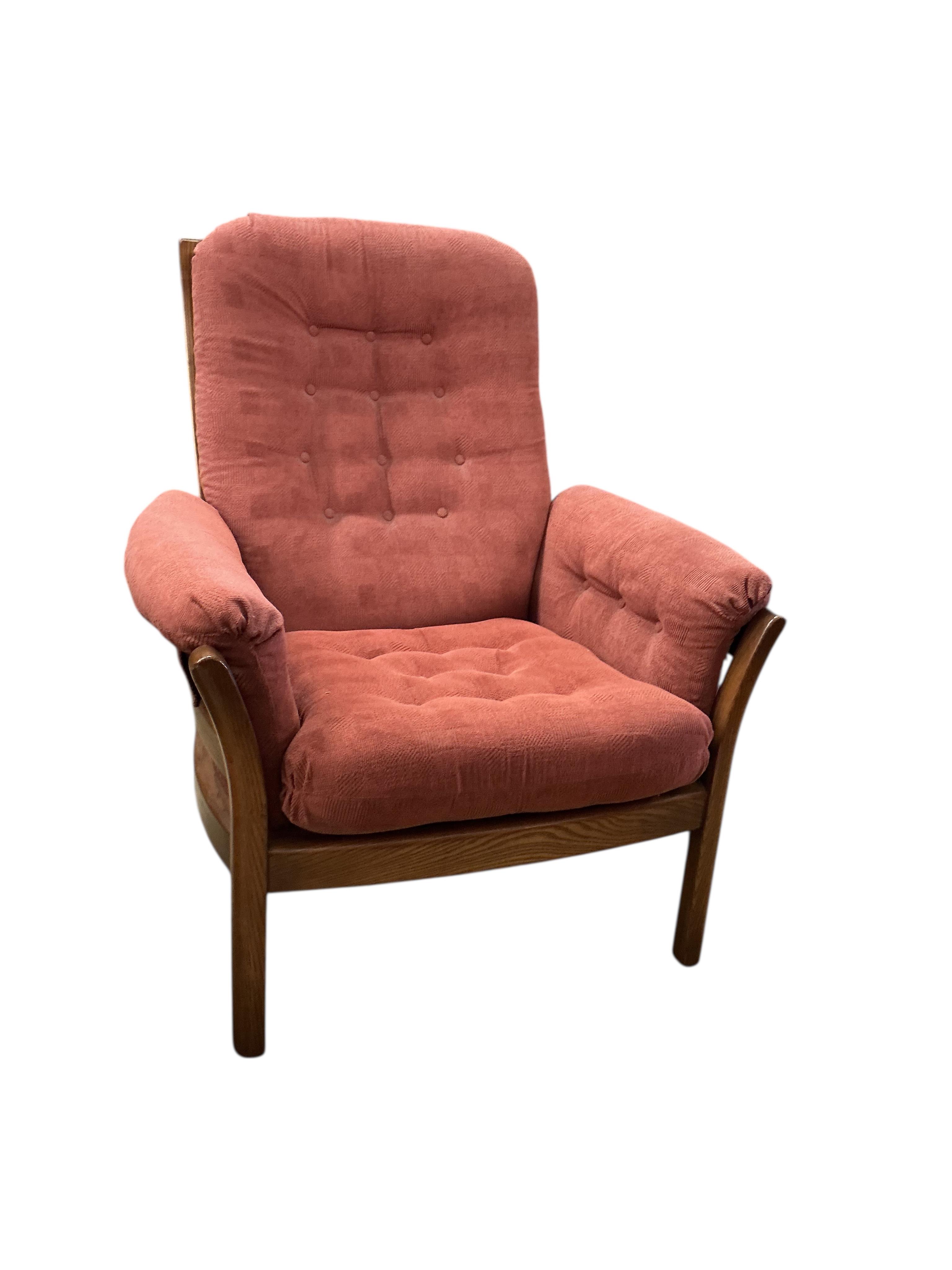 An Ercol elm three piece suite, settee width 130cm, depth 68cm, height 104cm